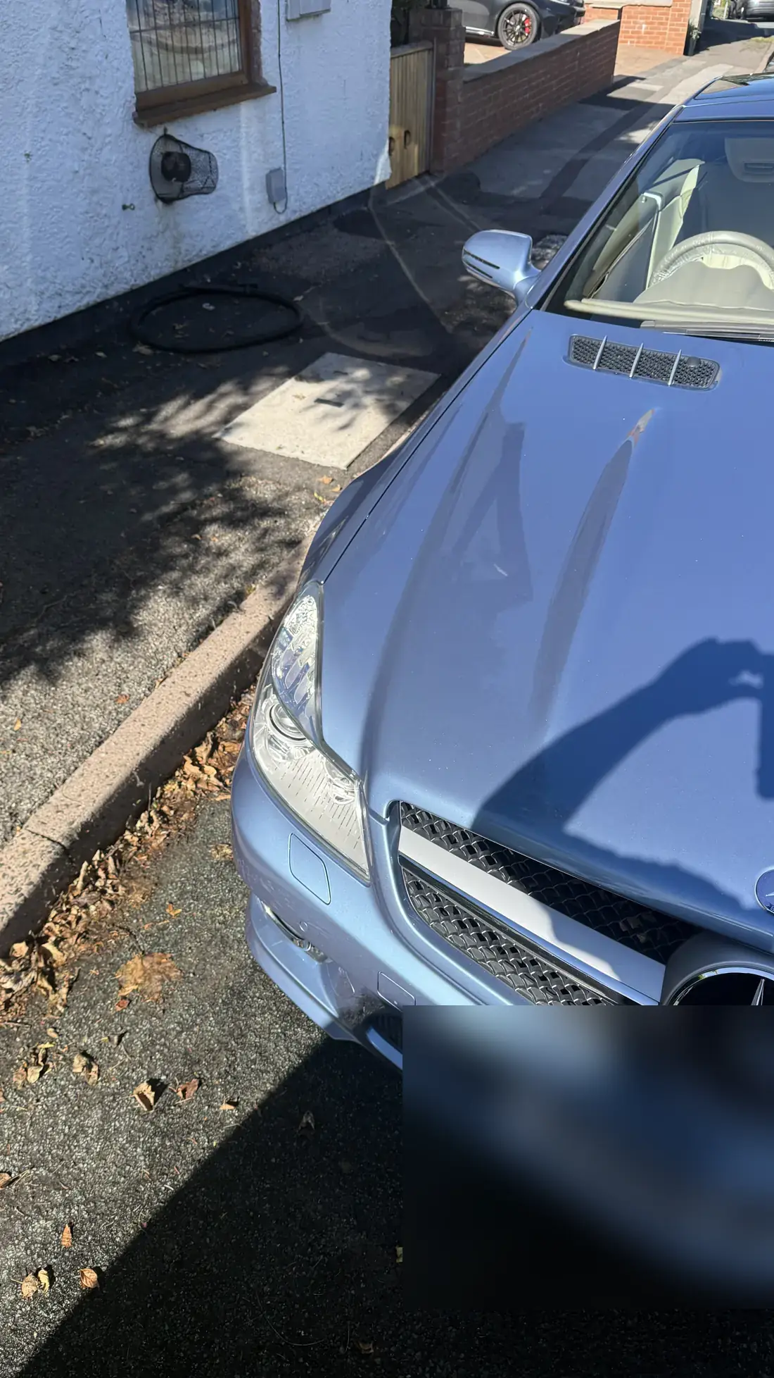 Silver-blue Mercedes SL bonnet after polishing