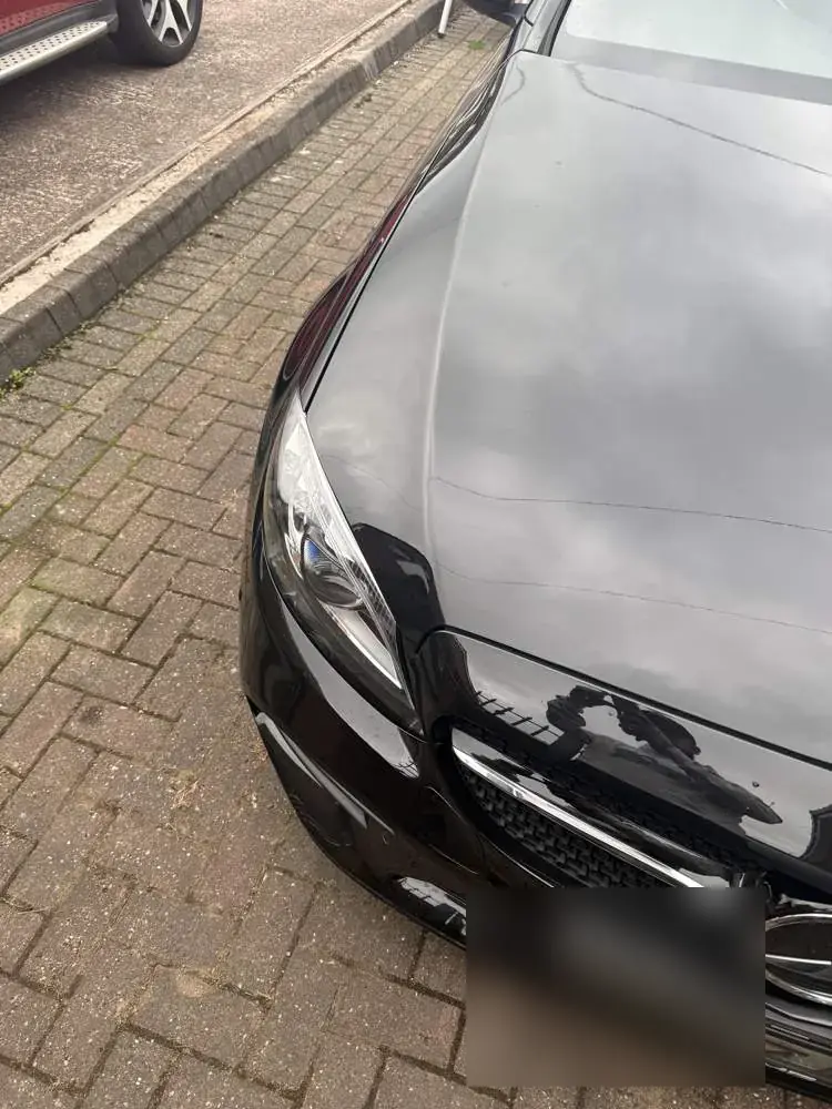 The same bonnet before polishing, dull and swirled