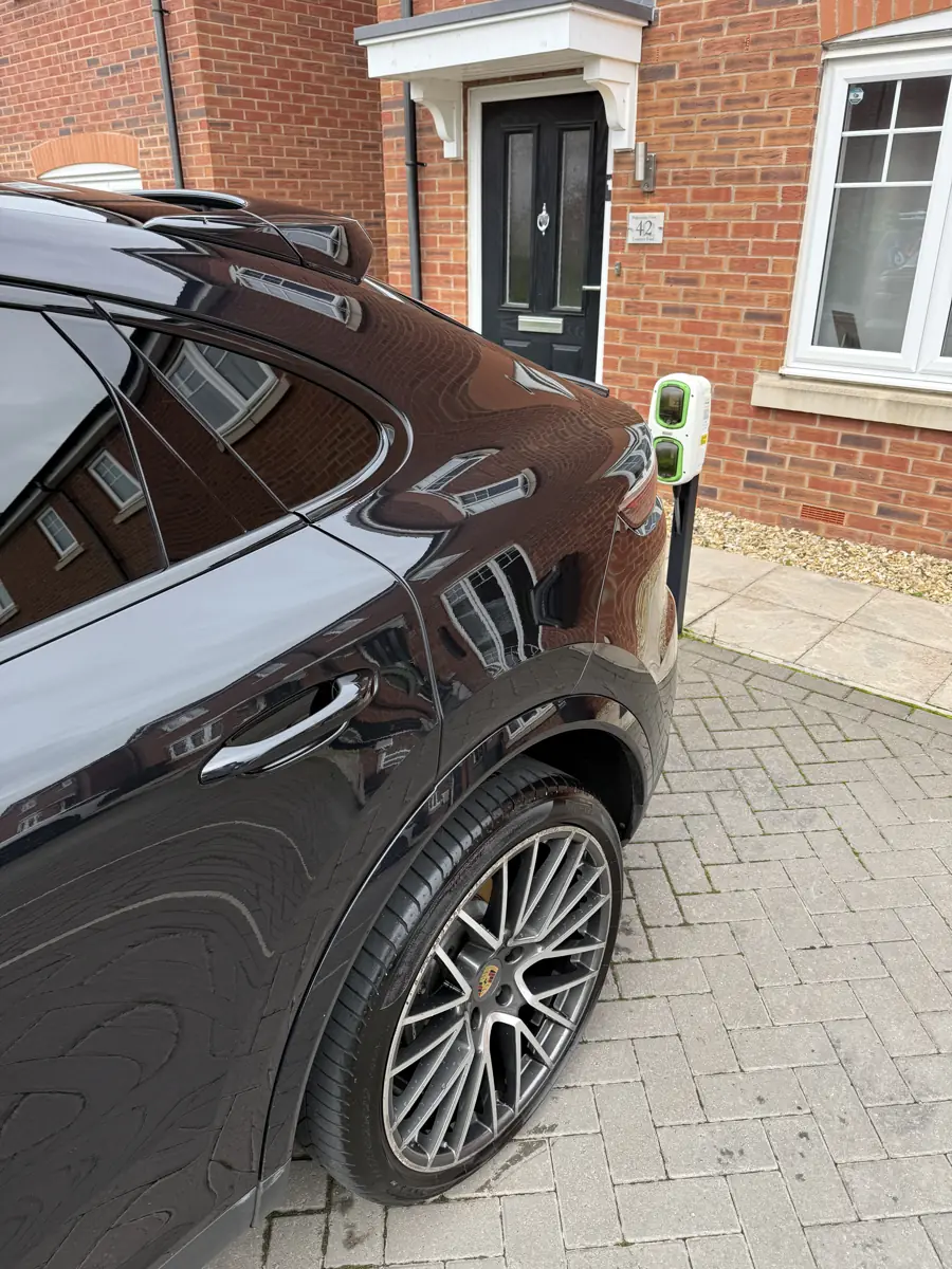 Black Porsche Cayenne rear wheel and door after a detail
